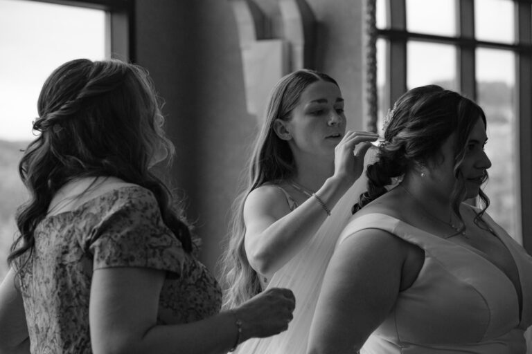 Black and white photo of Maddie getting ready for her Heritage Hills Golf Resort wedding in York, PA
