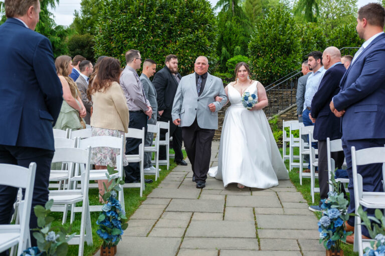 Maddie escorted down the aisle at the outdoor ceremony at Heritage Hills Golf Resort