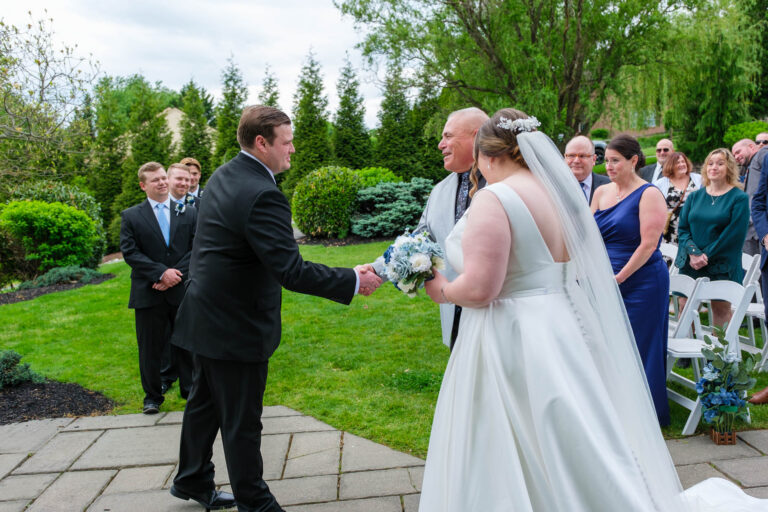 Maddie being given away at the end of the aisle at Heritage Hills Golf Resort