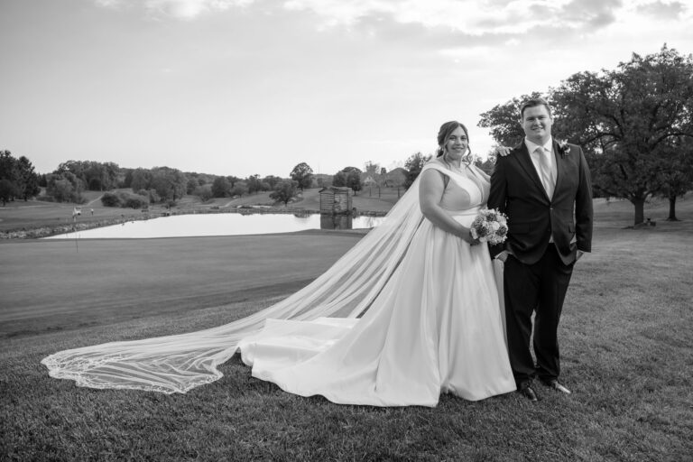 Black and white portrait of Dan and Maddie on the golf course at Heritage Hills