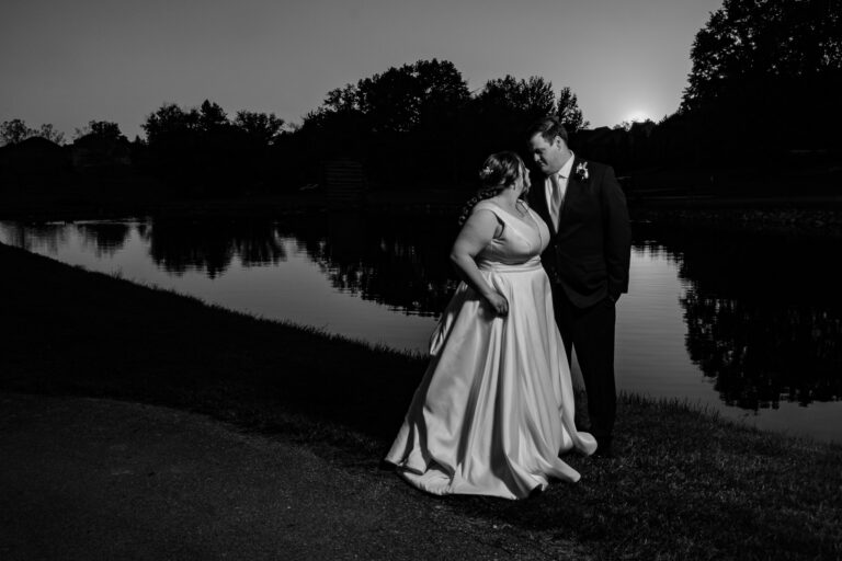 Black and white reflection portrait of Dan and Maddie on the pond at Heritage Hills Golf Resort