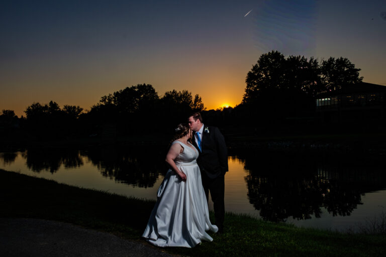 Dan and Maddie reflected in the pond at sunset at Heritage Hills Golf Resort in York, PA