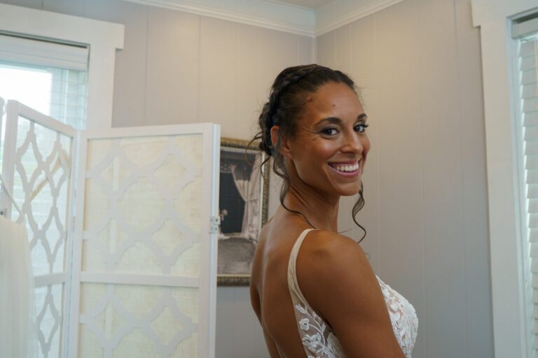 Jess smiling in her wedding dress before the ceremony at Rockfield Manor