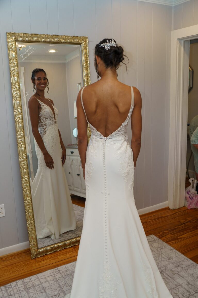 Jess in her wedding dress in front of the mirror at Rockfield Manor