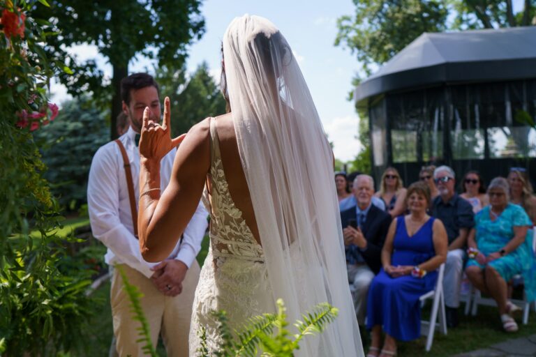 Jess and Jake exchanging vows in front of their guests at Rockfield Manor